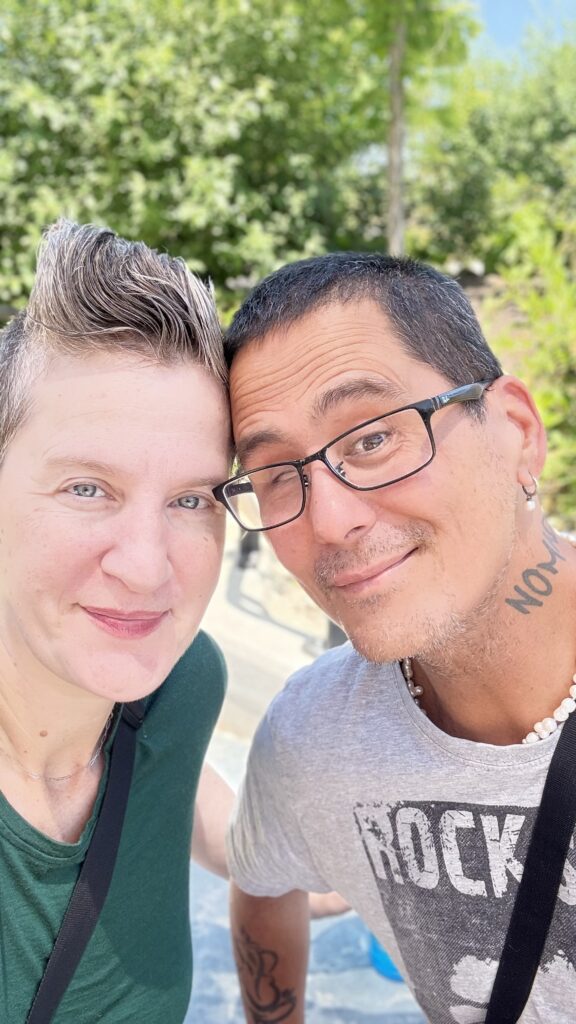 Couple walking in a park to get steps in after 50